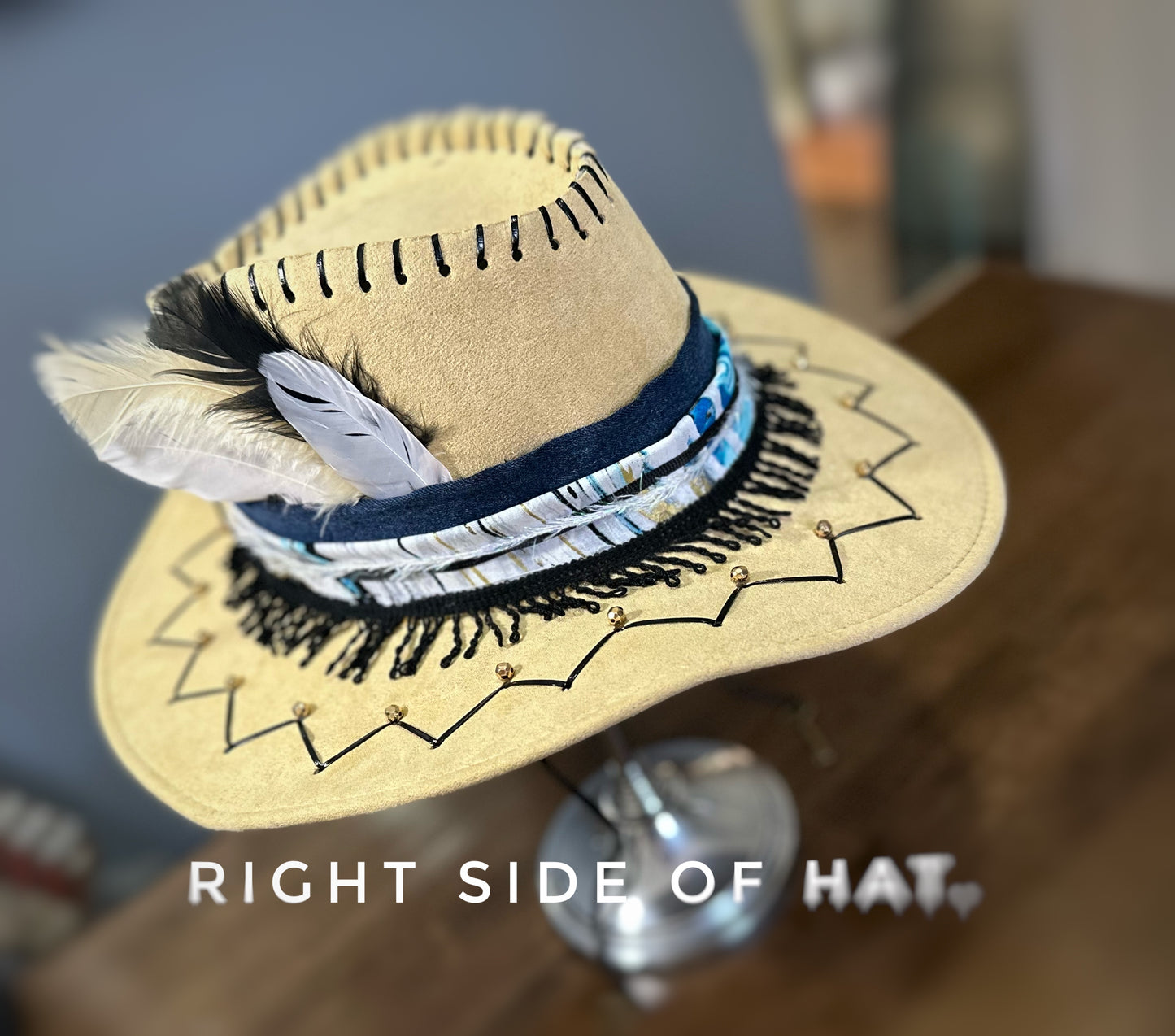 Blue, black and tan cowboy hat.