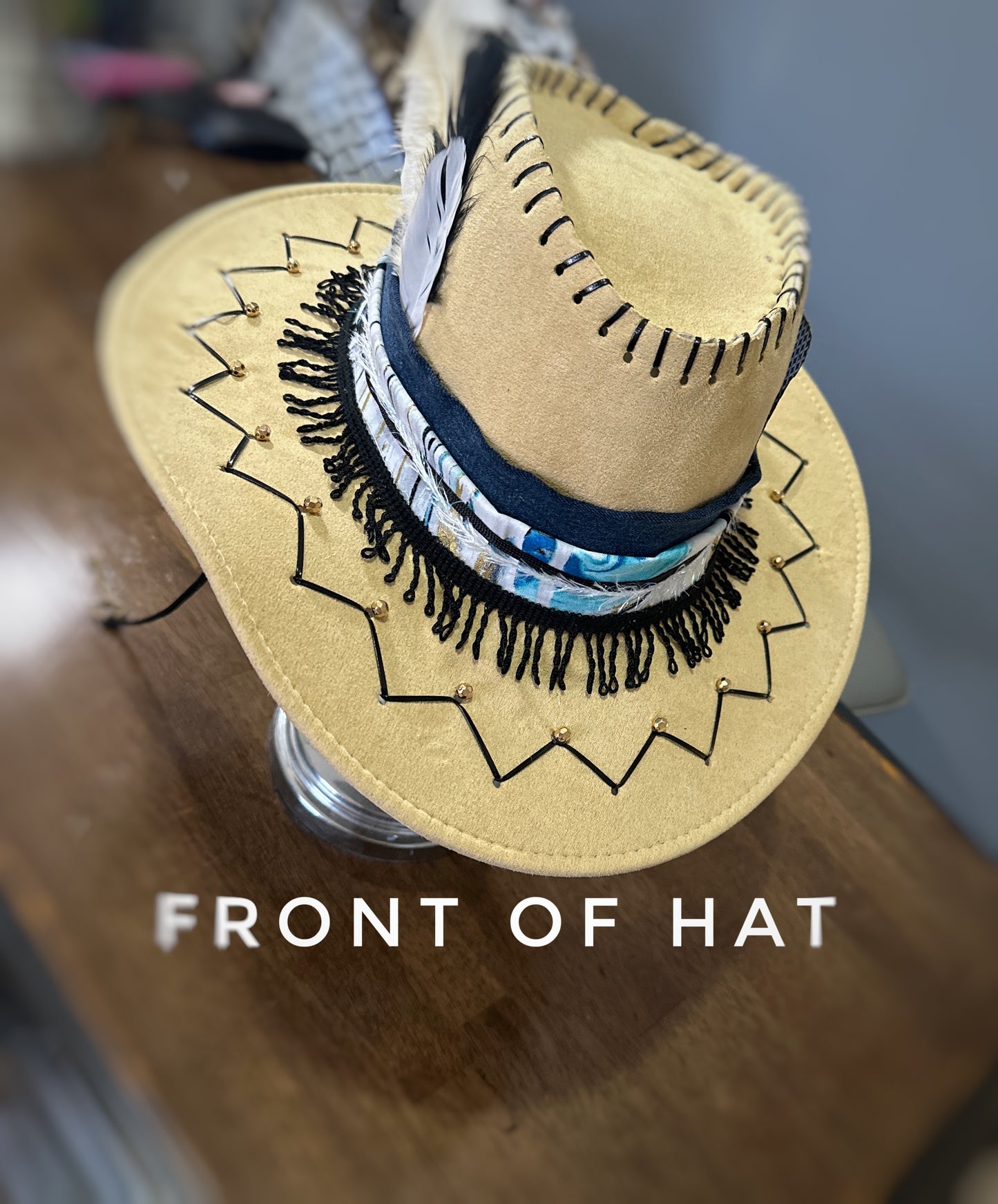 Blue, black and tan cowboy hat.